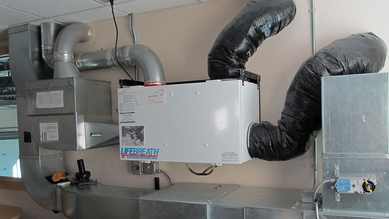Professional HVAC maintenance and air quality testing in an Edmonton home